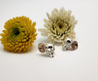 Skeleton and rosette earrings in silver and bronze