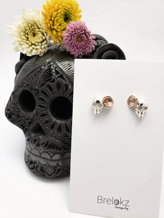 Skeleton and rosette earrings in silver and bronze